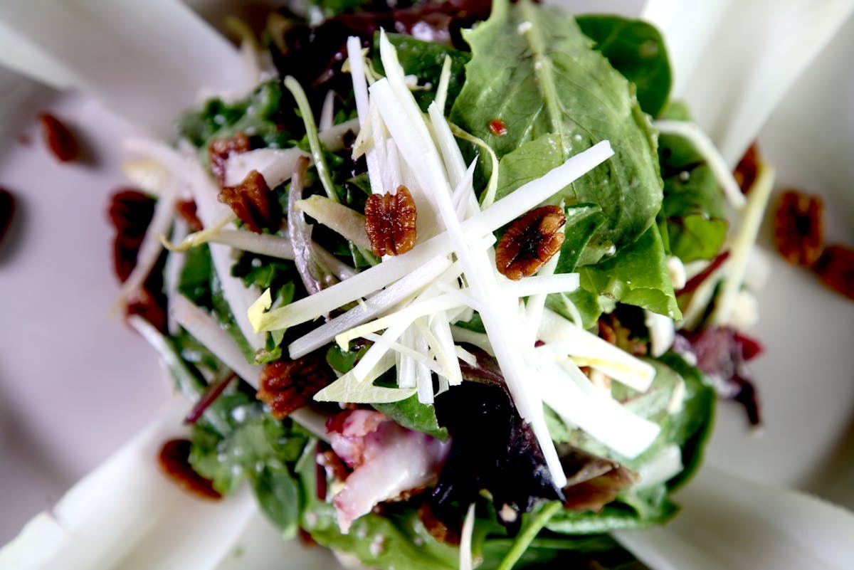 Salad with cheese on top. 